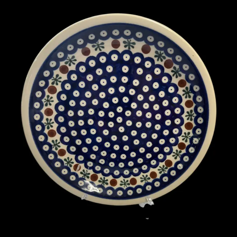 Hand-painted Polish Pottery dinner plate with blue, white, and brown floral pattern.