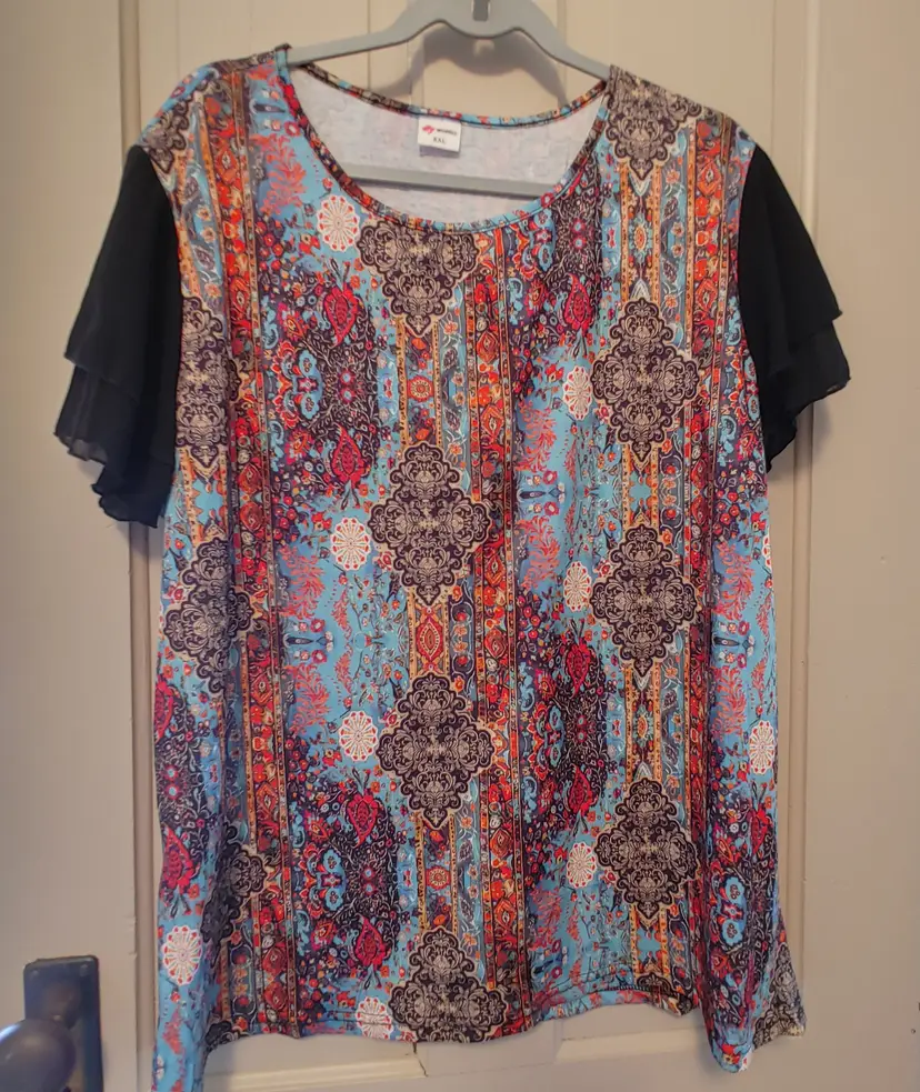 Top- Brand: Wiholl. Multicolored top with black sleeves. Size 2X. Material- 95 polyester, 5 elastane. No callouts.
