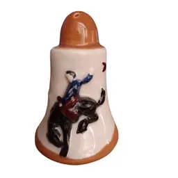 Vintage hand-painted cowboy riding bronc with calf salt shaker