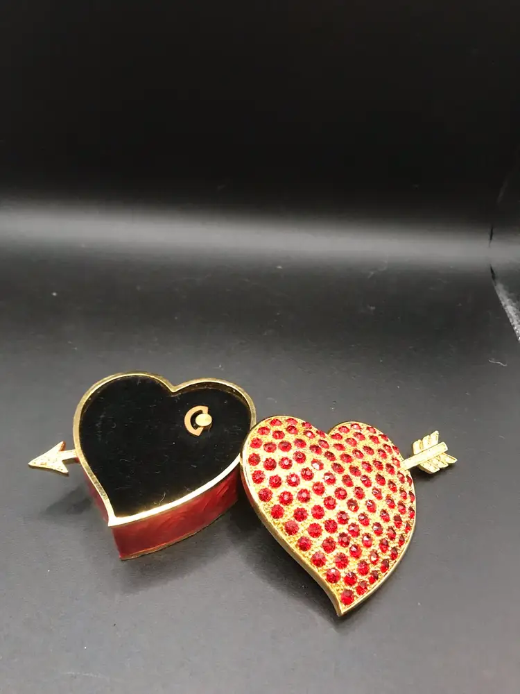 Vintage heart shaped faux rubies on a gold box music box