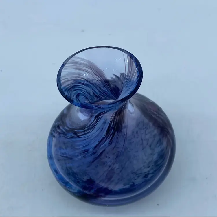 #0325 Caithness Scotland art glass vase with black and purple swirl pattern and label.