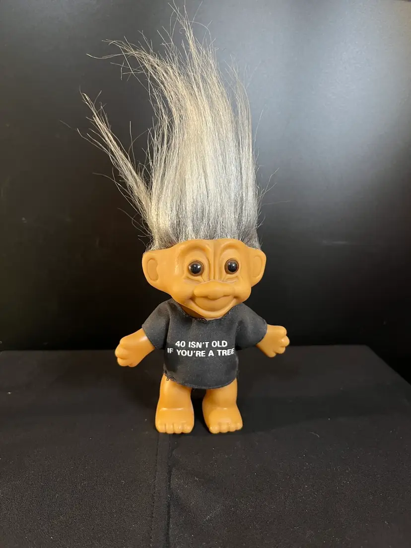 Vintage Russ Troll-features Black T Shirt Stating-"40 Isn't Old If You're A Tree"-Trademark Hair that is Silver-LOL. "Skin" is slightly UV reactive-green.