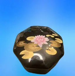 Otagiri black lacquered octagonal trinket box with lotus and lily pad design.