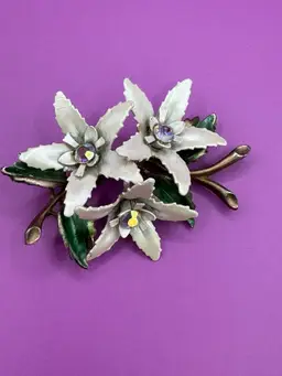 White Flower Brooch with Green Leaves and Aurora Borealis Center