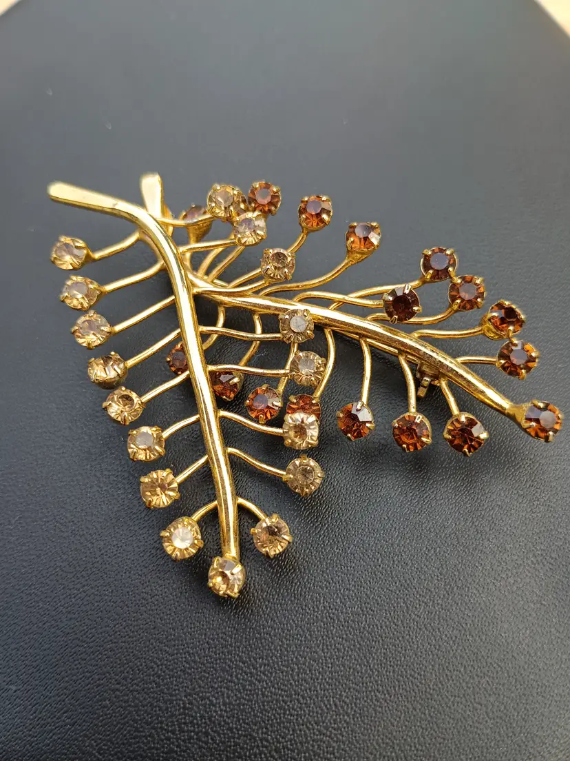 Two Tone Brown Swarovski Crystal Rhinestone and Goldplate Brooch Marked TC.