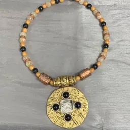 Tribal style necklace, gold tone pendant