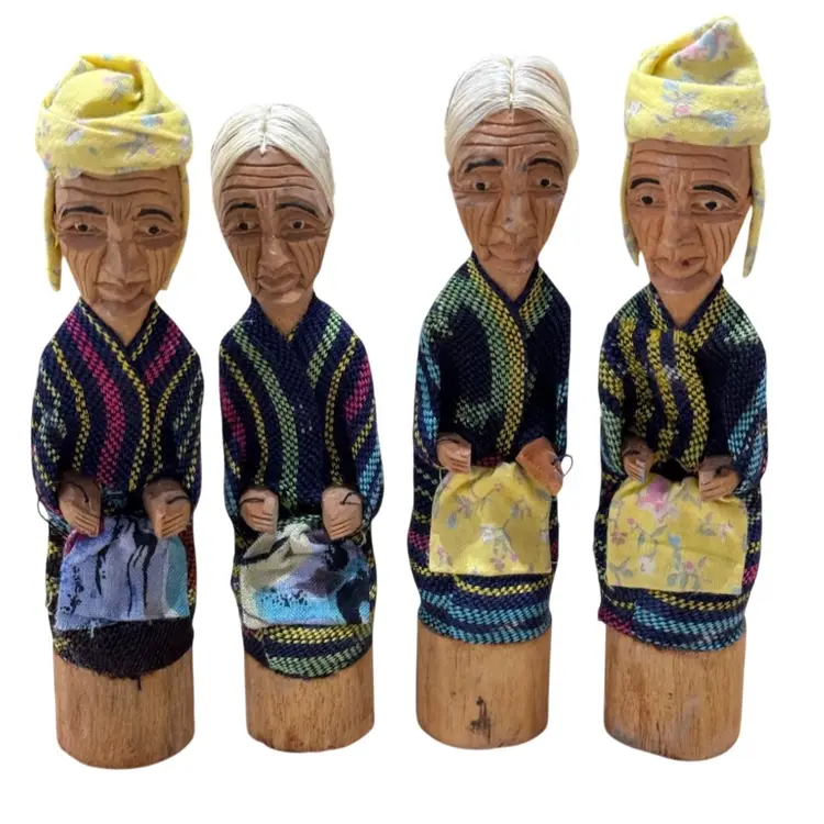 Tau-tau figurines, which are traditional wooden effigies from the Toraja ethnic group in South Sulawesi, Indonesia