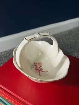 Vintage Savannah Ivory Porcelain Basket with a floral pattern and bow handle with gold accents