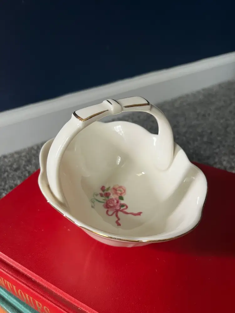 Vintage Savannah Ivory Porcelain Basket with a floral pattern and bow handle with gold accents