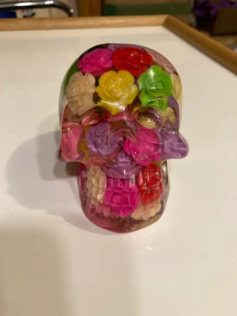 Floral multicolored resin skull figure paperweight