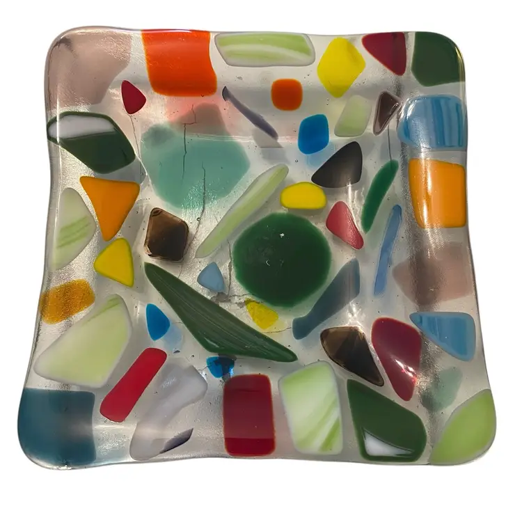 This is a handmade multicolored fused glass dish with a "crazy paving" design