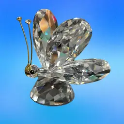 A faceted crystal teddy bear figurine by Swarovski with original packaging. Great Christmas Gift Idea