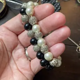 Two stretch bracelets, one black one white