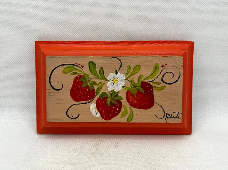 Tole painting featuring strawberries and daisies on a wooden plaque signed