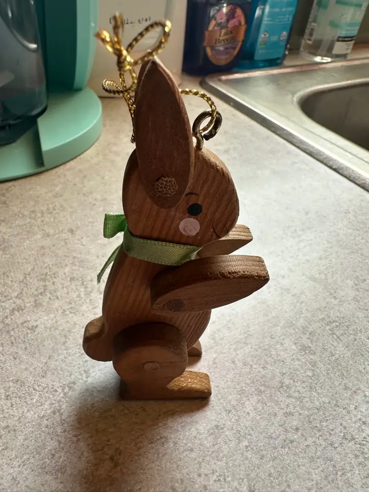 Wooden rabbit ornament with green ribbon collar. Vintage