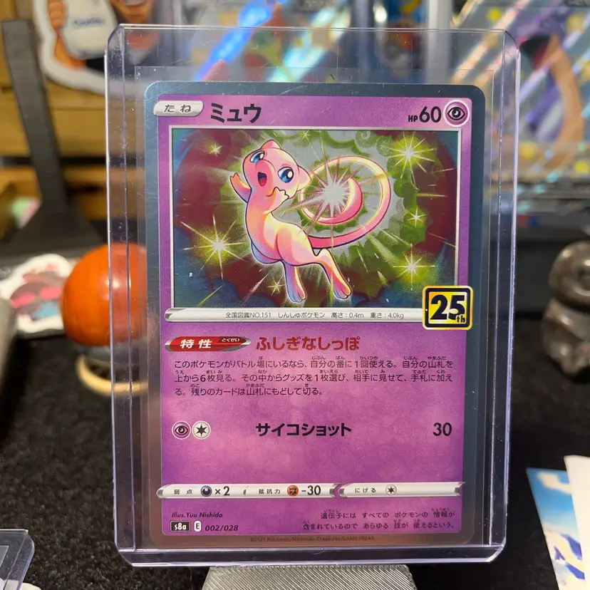 Japanese Mew card from the 25th Anniversary Collection (002/028) featuring the Mirror Holo pattern.
