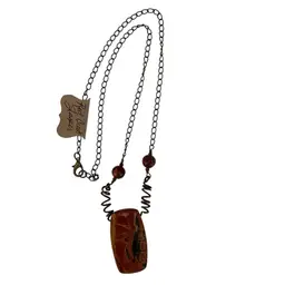 This is a handmade necklace featuring a rectangular red creek jasper pendant and copper wire and beads on an antique bronze-tone chain. Pendant Stone 1 3/4” Length. Chain Is 11” Drop, Chain Is 22” Total Length