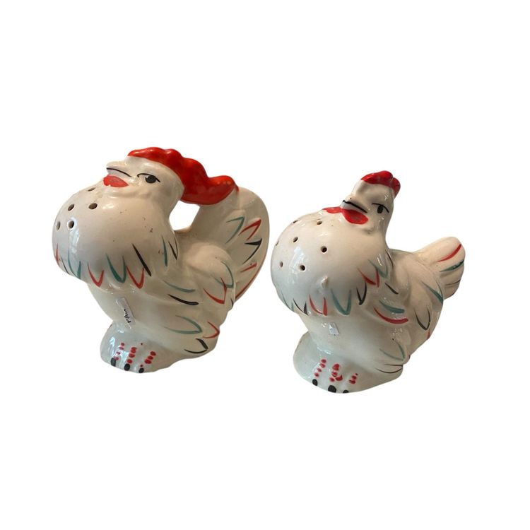 This is a pair of vintage mid-century rooster and hen ceramic salt and pepper shakers made in Japan.