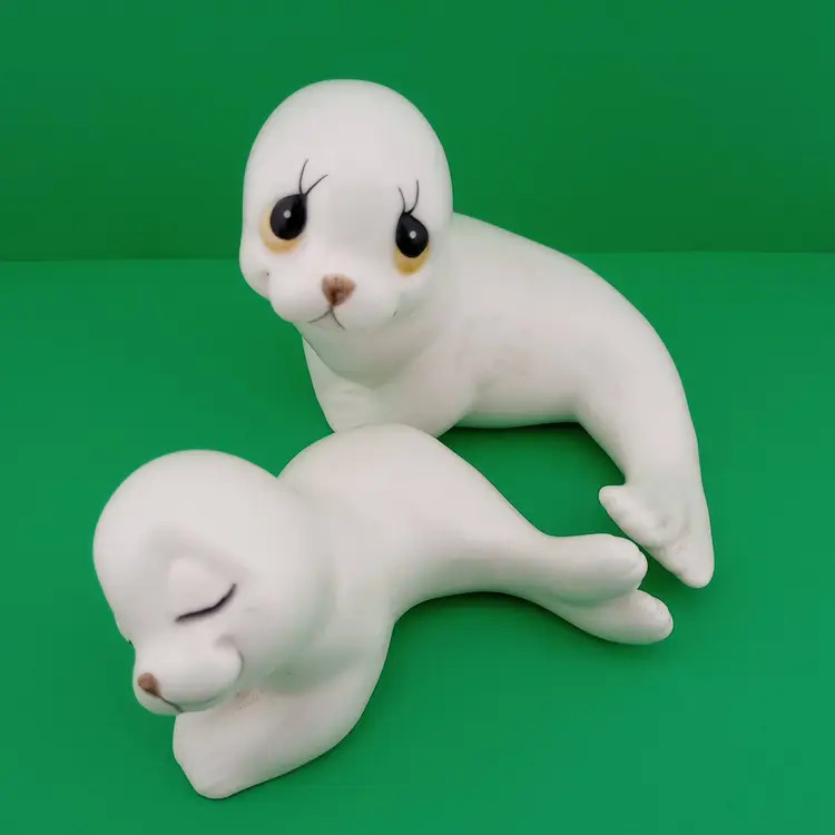 Pair of ceramic seal figurines
