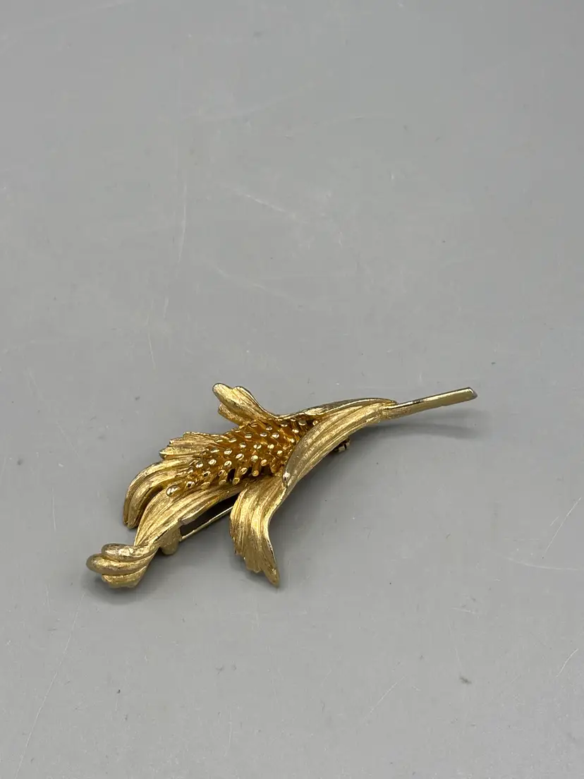 Vintage gold tone floral design