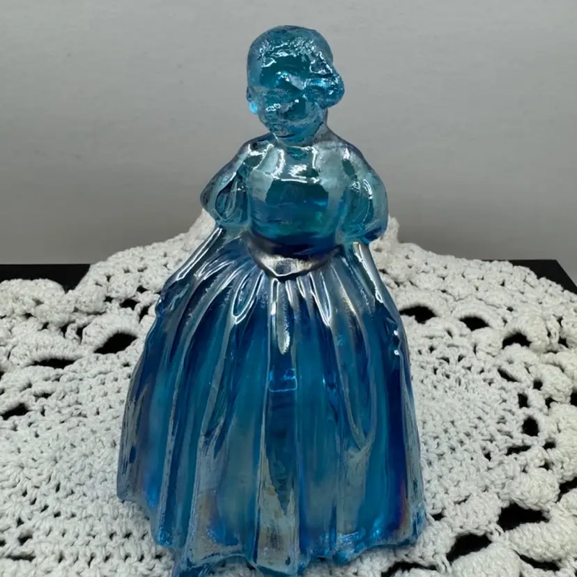 Glowy Blue iridescent carnival glass figurine of a Southern Belle by Wheaton, 4.75”