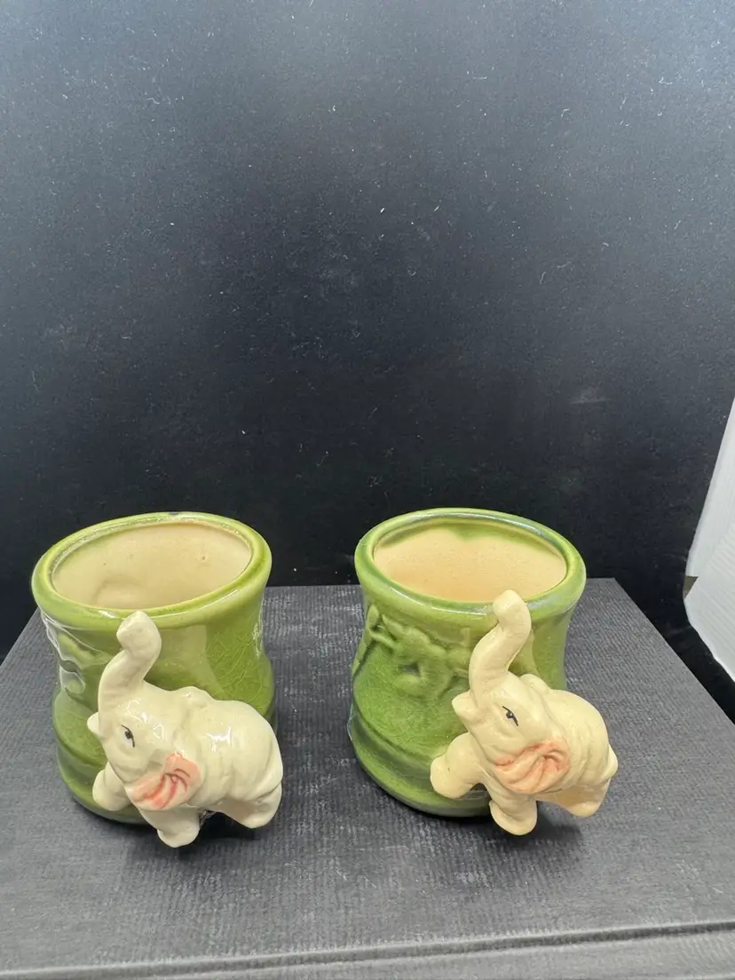 Pair of vintage green ceramic elephant planters