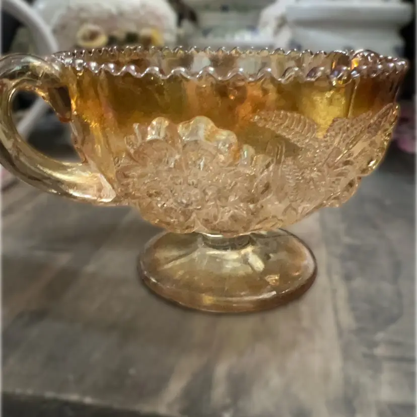 Vintage Dugan Marigold carnival glass Two handled compote with floral and wheat pattern. 4x7”  Compote With Sawtooth Edge, Pressed Glass, Unmarked.