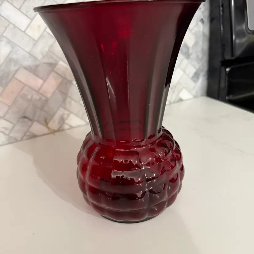 Anchor Hocking Royal Ruby red glass vase with pineapple/thistle pattern. 9”x 6.5”