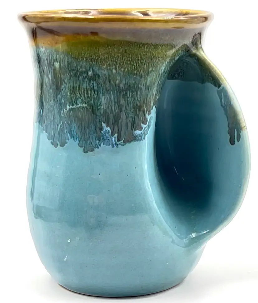 #663- Pottery Coffee Mug Right Hand Warmer Grip Blue w/ Brown Drip Glaze 
16oz Signed Neher 2010