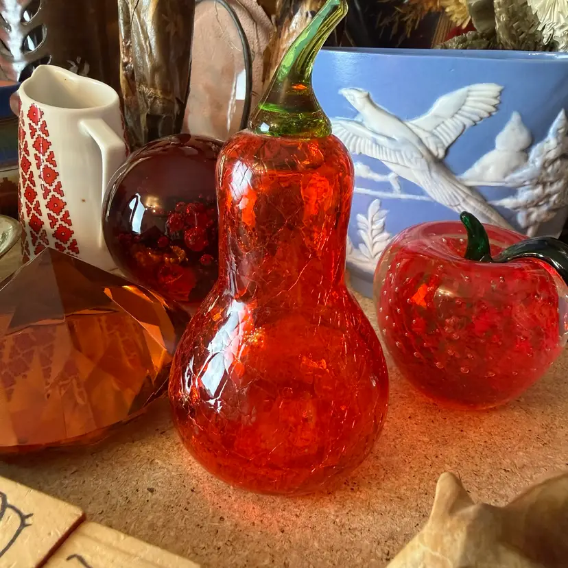 vintage red-orange crackle glass pear figurine featuring an applied green stem. Nice Weight To It