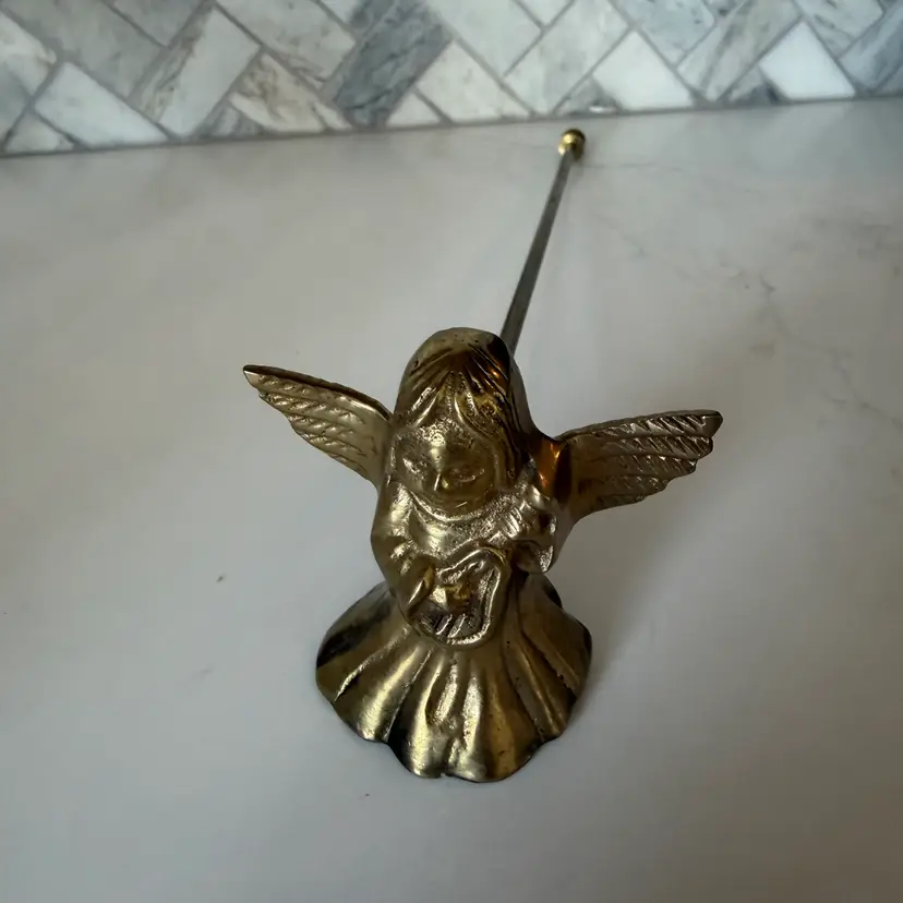 Vintage brass angel candle snuffer with a lyre and metal rod. 3”x11”
