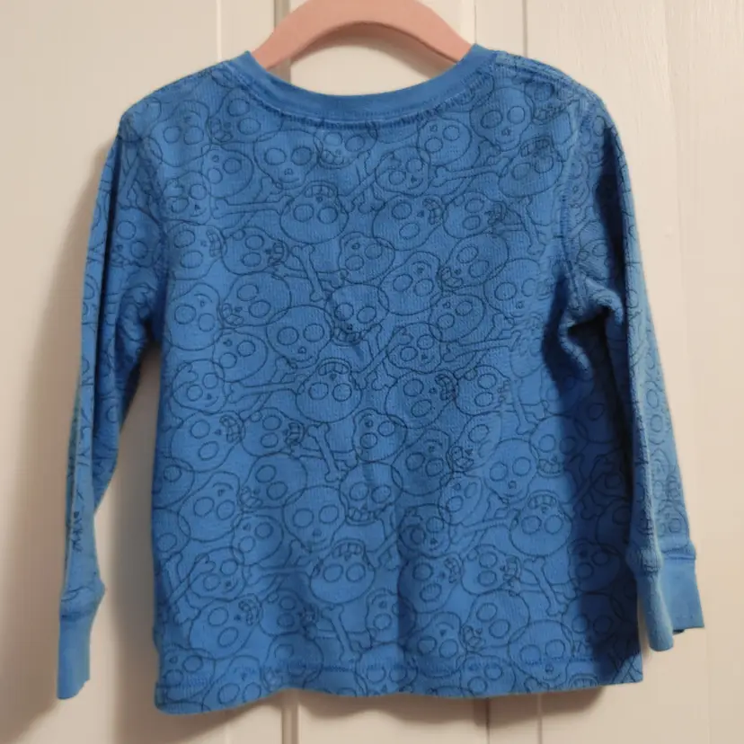Kids- Brand: Peanut & Ellie. Size 3T. Blue skull shirt. Material- 60% cotton, 40% polyester. No callouts.
