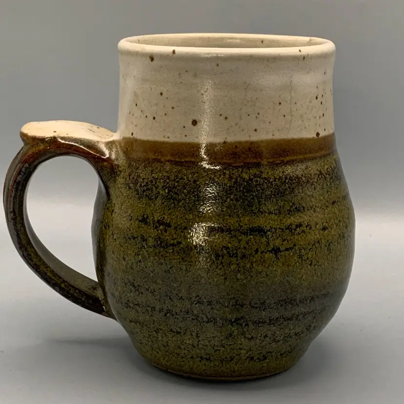 Studio pottery mug signed. Pretty glaze. Holds 13 ounces.