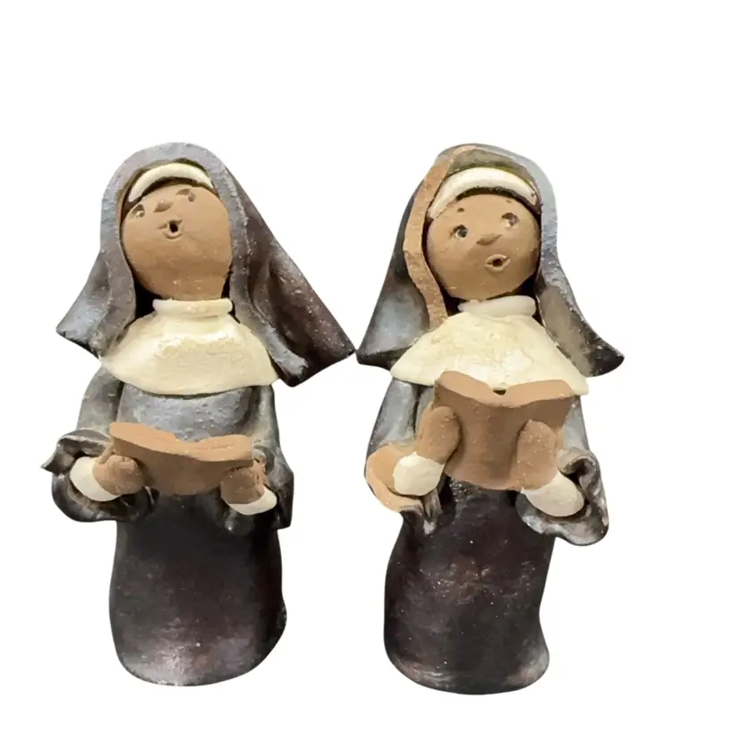 A Set Of Two Nuns Singing Hand Built Pottery