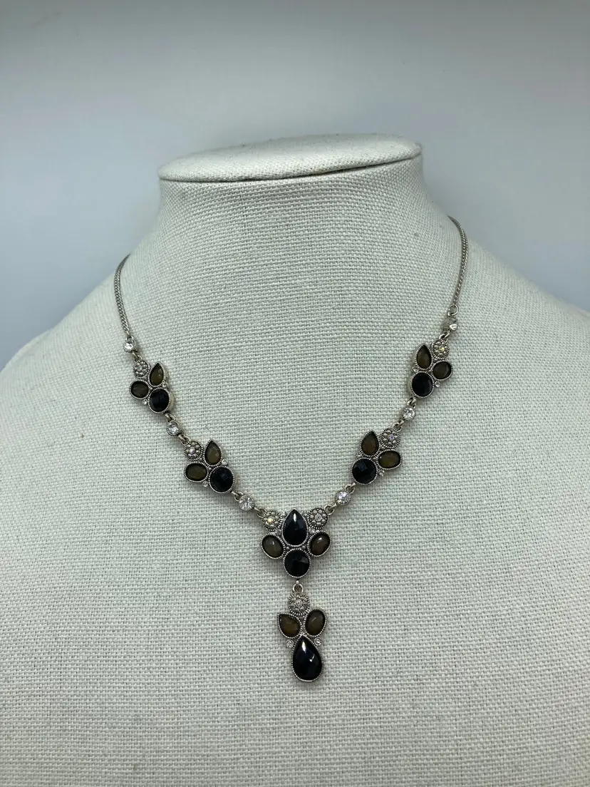 Art Deco-style Y-necklace featuring black and smoke-colored faceted teardrop crystals, small clear rhinestones, and antique silver-tone metal settings