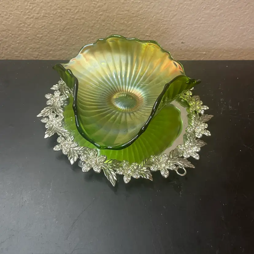 1960 Fenton Green Carnival Glass 6” Stippled Rays Bowl w/ ruffled edge and iridescent finish.