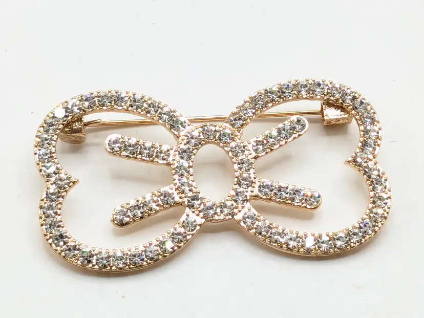 Gold Tone Sparkling Rhinestone Bow Brooch
