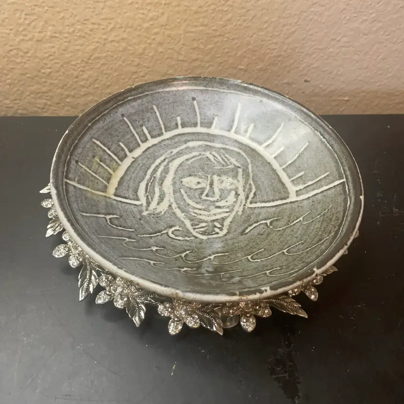 Signed Beitz sgraffito-carved face with a sun and ocean wave 7” Bowl