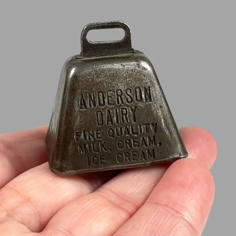 Old Metal Cow Bell. 1-1/2” Mini. Stamped Anderson Dairy Fine Quality, Milk, Cream, Ice Cream. Advertisement.