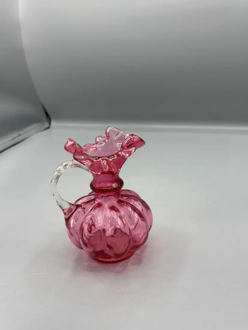 Vintage Fenton cranberry pitcher with clear handle