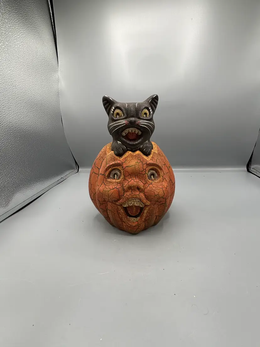 Vintage Halloween cat on pumpkin
