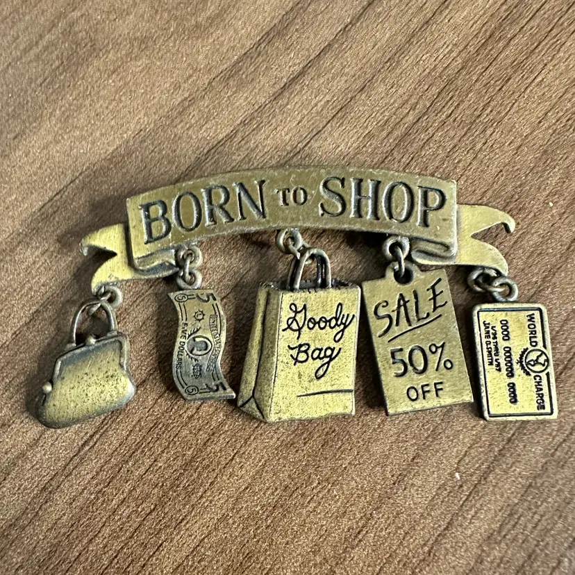 JJ Brooch Born To Shop With 5 Charms Brass-Tone