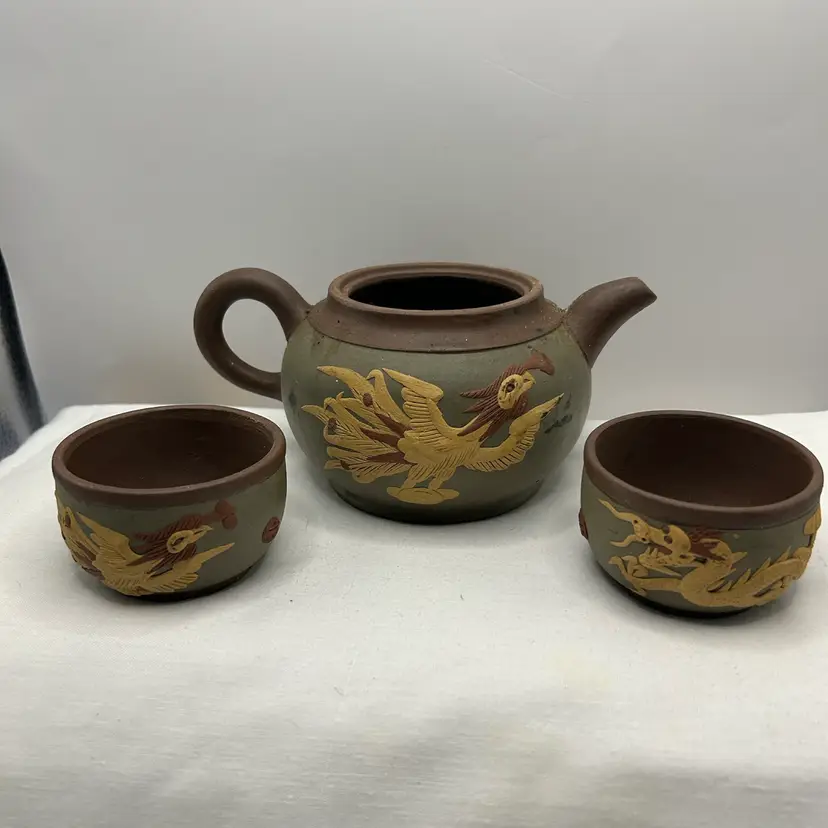 Yixing Zisha Tea Set Dragon Phoenix Embossed Teapot & 2 Tea Cups.  Missing teapot Lid