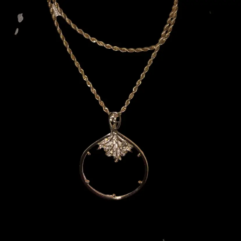 Magnifying Glass On A Gold Tone Chain