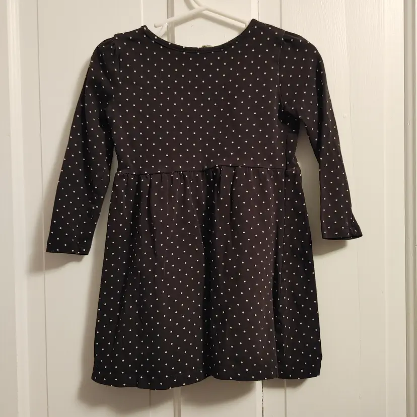 Kids- Brand: H & M. Size 1.5-2 years. Black white polka dot shirt. Material- 96% cotton, 4% elastane. No callouts.