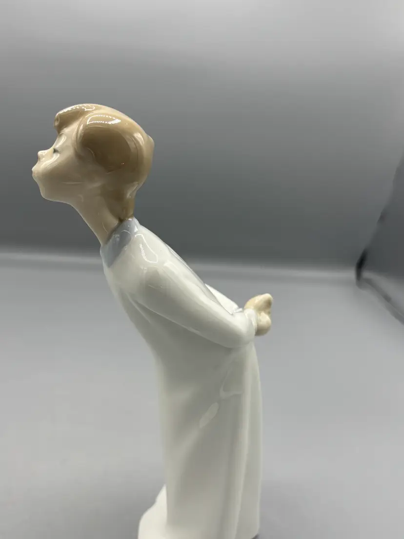 Vintage Lladro boy Blowing a kiss