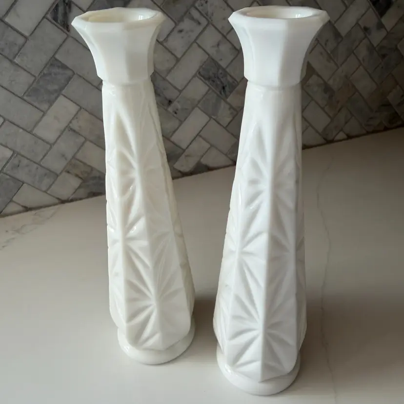 A pair of vintage milk glass starburst pattern bud vases. 8.5”