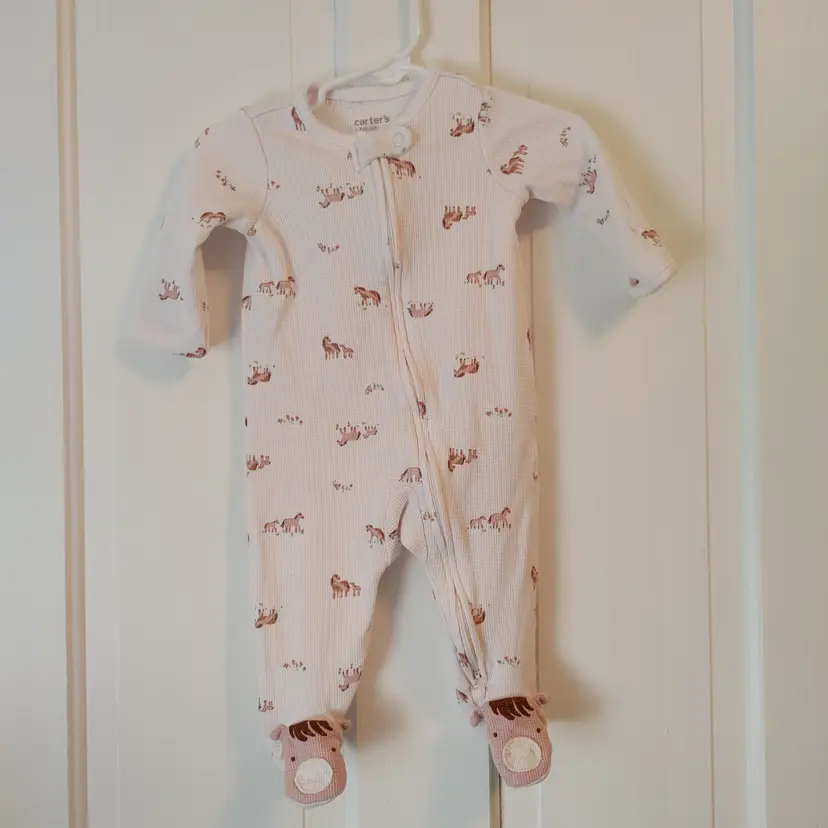 Kids- Brand: Carter's. Size 6 Months. Footed sleeper with horses. Material- 60% cotton, 40% polyester. No callouts.
