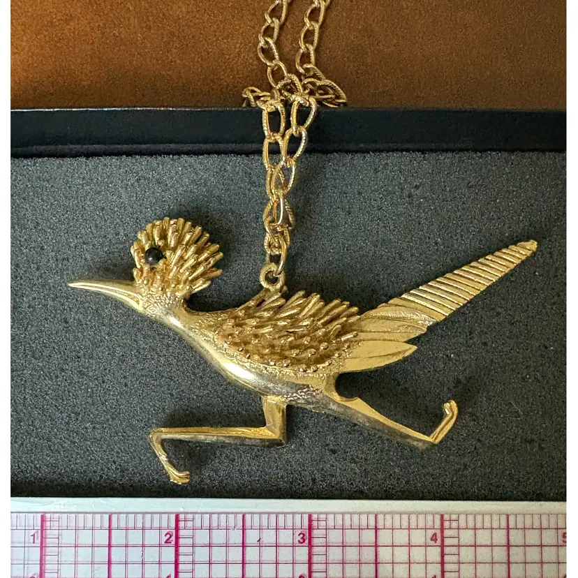 Vintage gold-tone roadrunner bird statement pendant necklace, circa 1970s.