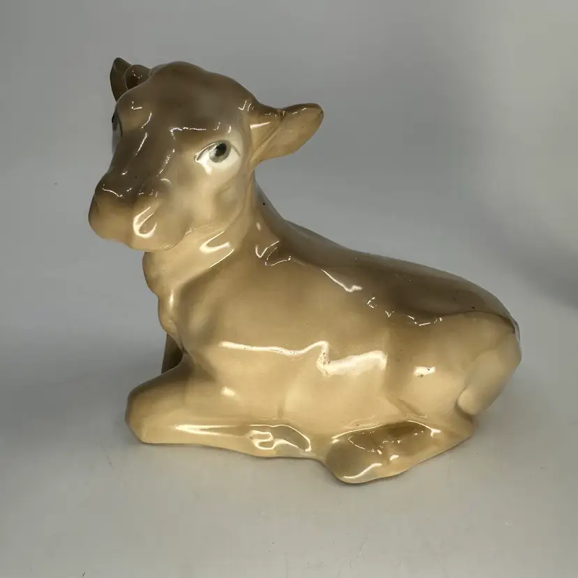 Porcelain Laying Cow Figurine